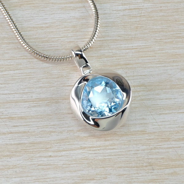 Knot Design Blue Topaz and Sterling Silver Pendant.