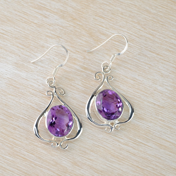 Decorative Sterling Silver and Faceted Amethyst Drop Earrings.