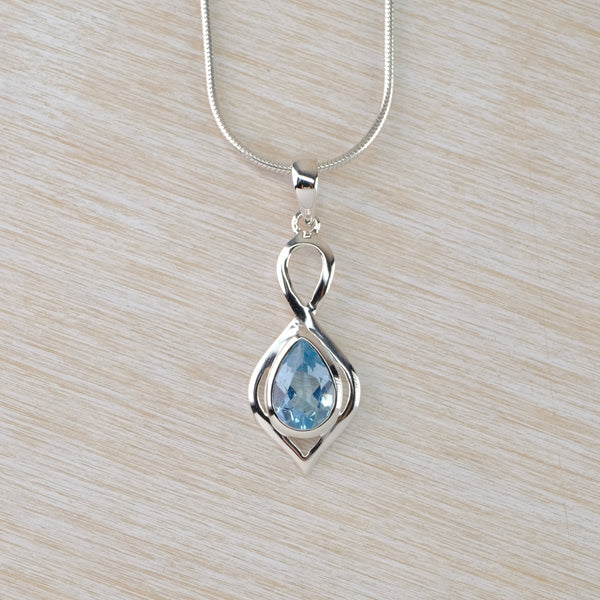 Decorative Blue Topaz and Silver Pendant.