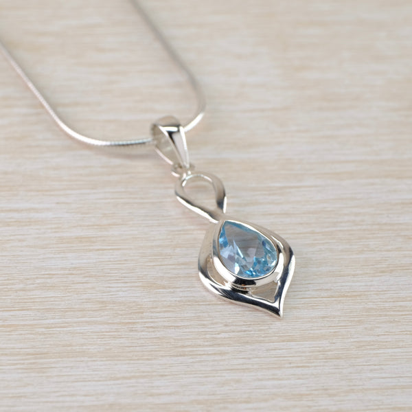 Decorative Blue Topaz and Silver Pendant.