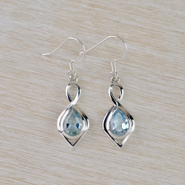 Silver and Faceted Blue Topaz Drop Earrings.