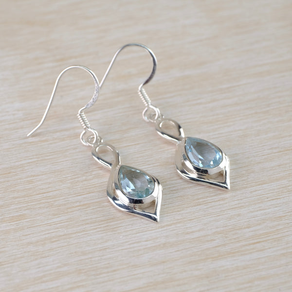 Silver and Faceted Blue Topaz Drop Earrings.