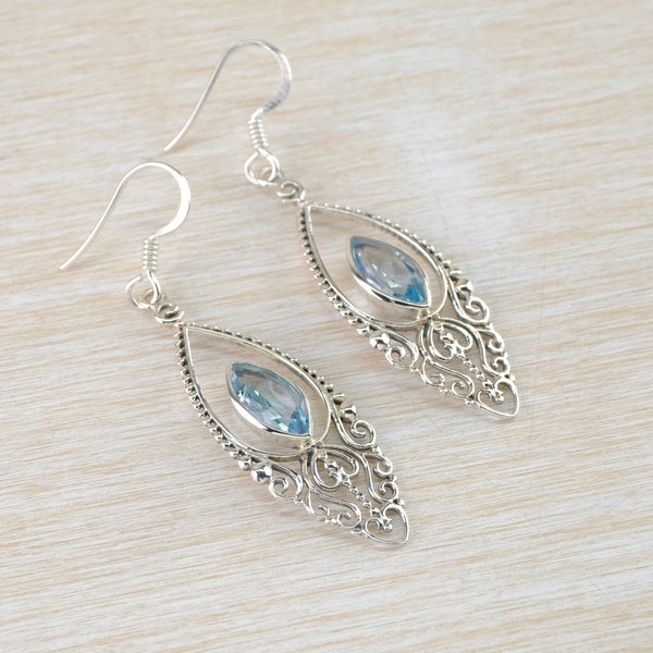 Ornate Silver and Blue Topaz Drop Earrings.