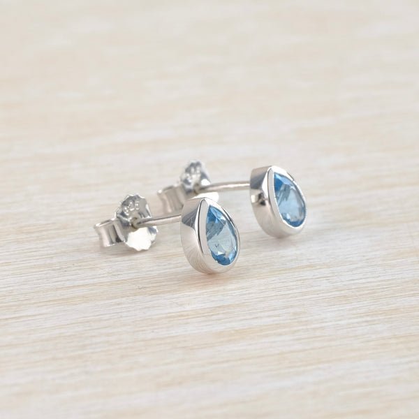 Tear Drop Blue Topaz and Silver Stud Earrings by JB Designs.