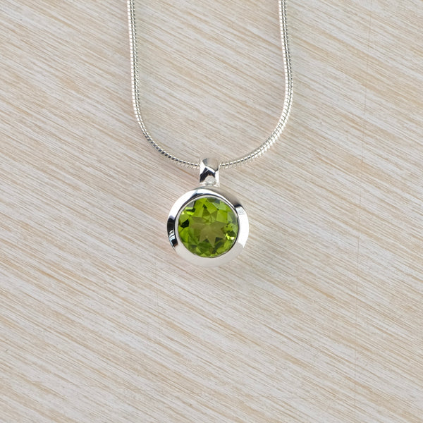 Round Silver and Peridot Pendant.