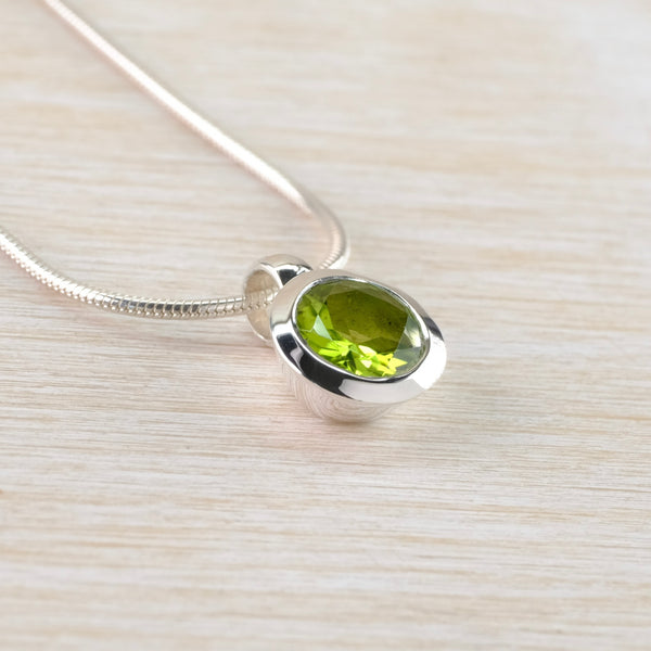 Round Silver and Peridot Pendant.