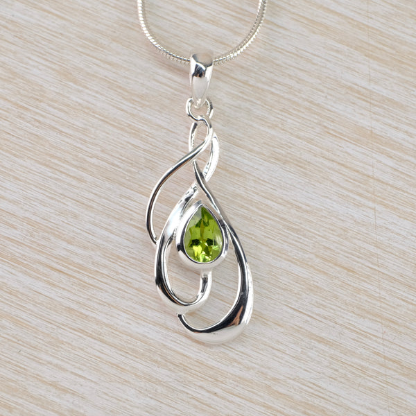 Silver Swirl and Peridot Pendant.