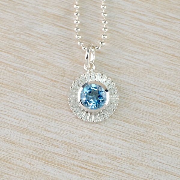 Round 'Sun' Silver and Blue Topaz Pendant.