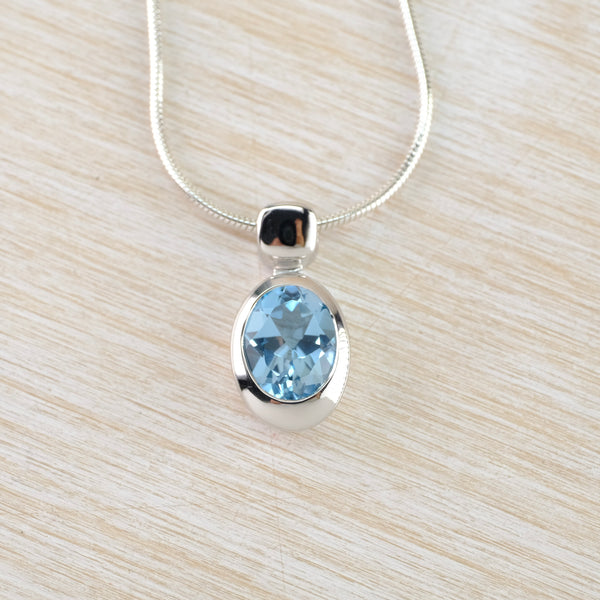 Oval Blue Topaz and Silver Pendant by JB Designs.