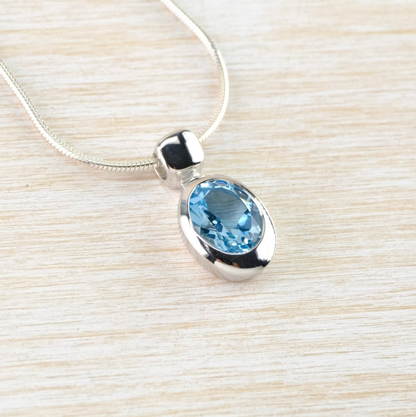 Oval Blue Topaz and Silver Pendant by JB Designs.