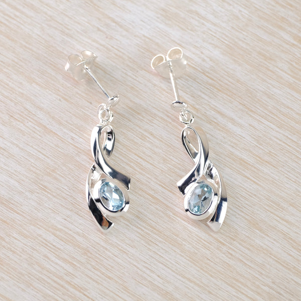 Oval Blue Topaz and Silver Earrings by JB Designs.