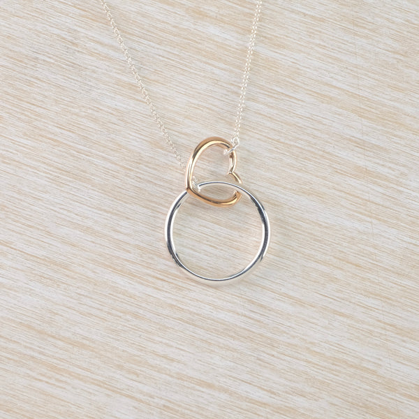 Silver Circle and Gold Plated Heart Necklace.