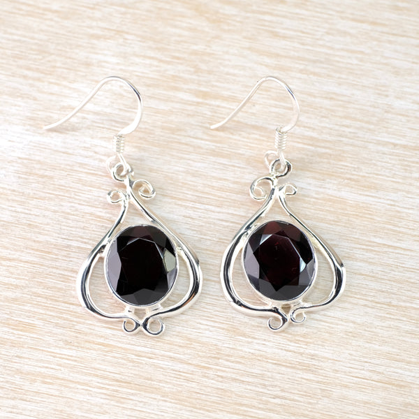 Decorative Silver and Garnet Drop Earrings.