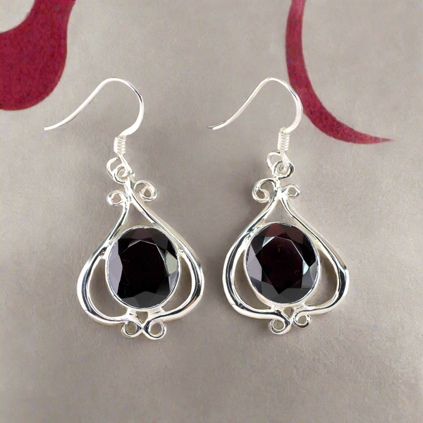 Decorative Silver and Garnet Drop Earrings.