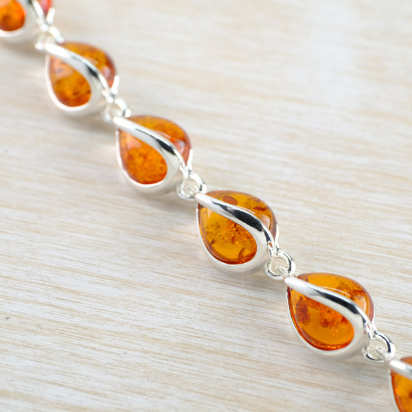 Silver and Tear Drop Cognac Amber Bracelet with Silver Overlay.