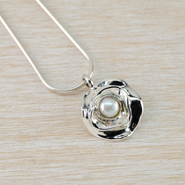 Sterling Silver Flower Pendant with Central Pearl.