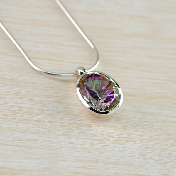 Oval Silver and Mystic Topaz Pendant.