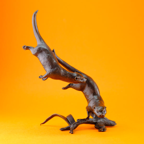 Bronze 'Otters Swimming' by Michael Simpson.