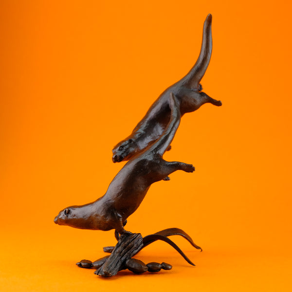 Bronze 'Otters Swimming' by Michael Simpson.