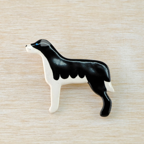 Handmade Black and White Ceramic Dog Brooch.