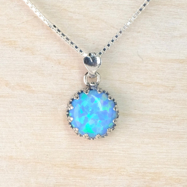 Decorated Round Sterling Silver and Opal Pendant.