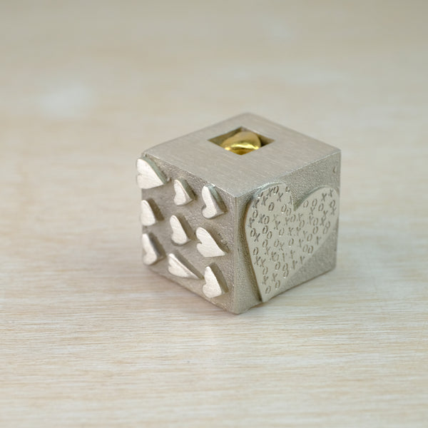 A Solid Pewter 'Love' Cube