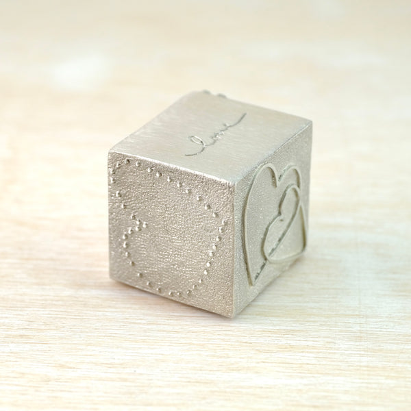 A Solid Pewter 'Love' Cube