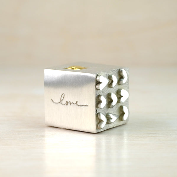 A Solid Pewter 'Love' Cube