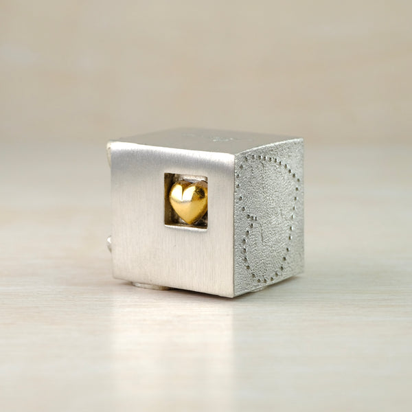 A Solid Pewter 'Love' Cube