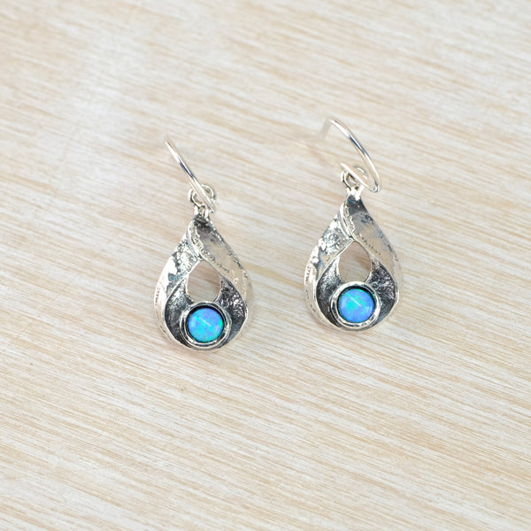 Silver earrings with bright blue gemstones 