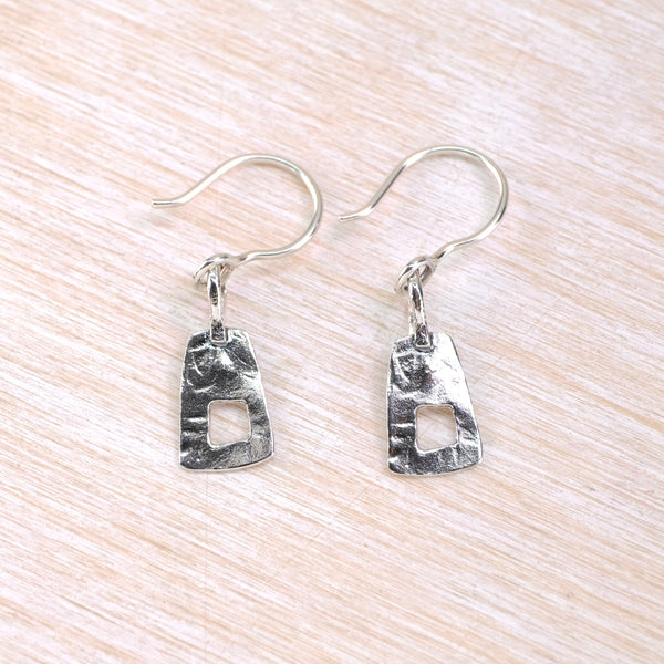 Pair of  hammered silver earrings  with a soft geometrc shape