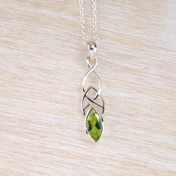 Celtic Design Silver and Peridot Pendant.