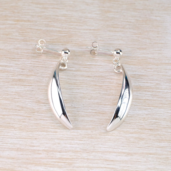 Shiny Silver earrings with an elegant curved drop dangling from a stud fitting