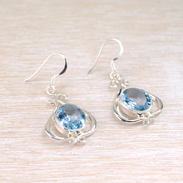 Ornate Silver and Blue Topaz Drop Earrings.