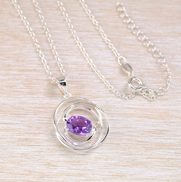 Sterling Silver Twist and Faceted Amethyst Pendant.