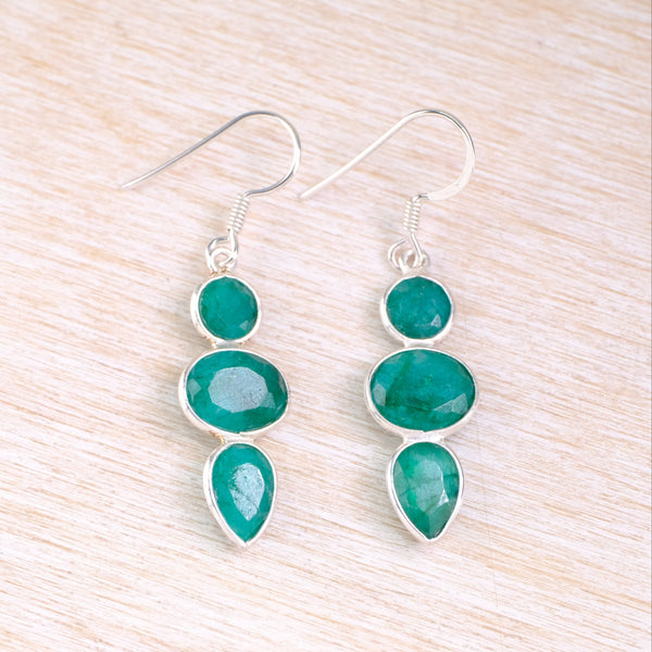 Pair of opaque dark green gemstone earrings, each with three stones set one below the other.