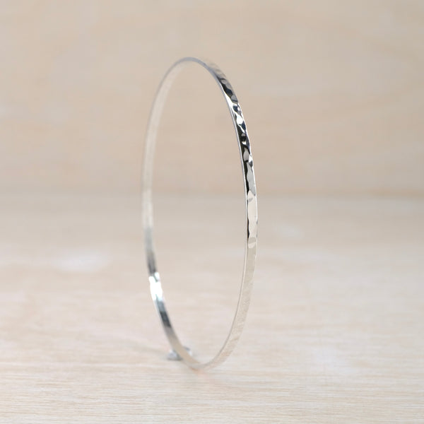 slim silver bangle with a hammered finish