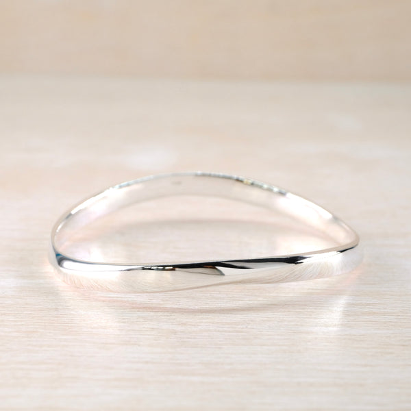 Gently Curved Sterling Silver Bangle.