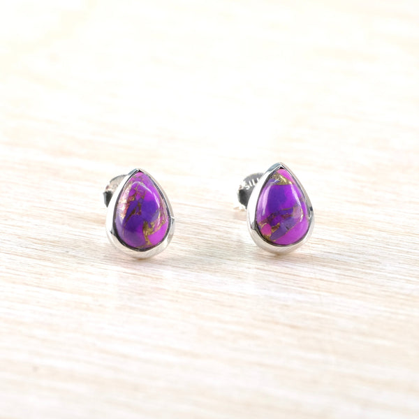 Teardrop-shaped purple earrings with silver setting