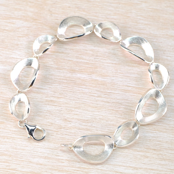 Organic Satin and Polished Silver Link Bracelet.