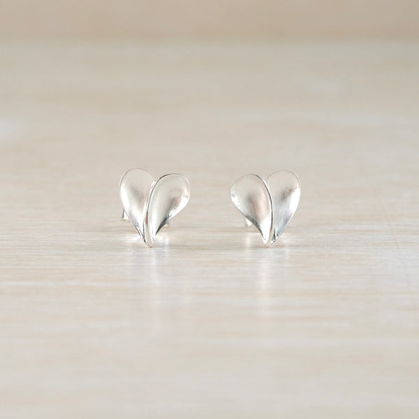 Heart-shaped silver earrings with a contemporary style