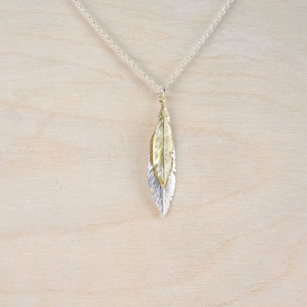 Silver and Gold Feather Pendant Necklace by JB Designs.