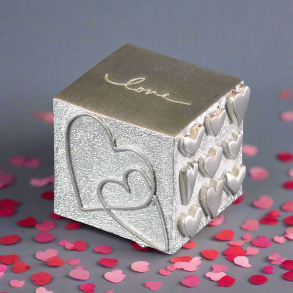 A Solid Pewter 'Love' Cube