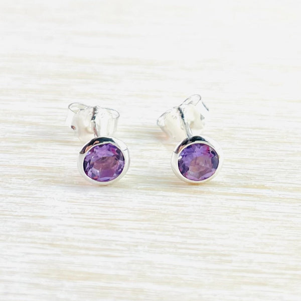 Round Sterling Silver and Amethyst Stud Earrings.