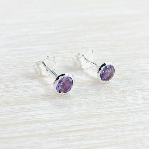 Round Sterling Silver and Amethyst Stud Earrings.