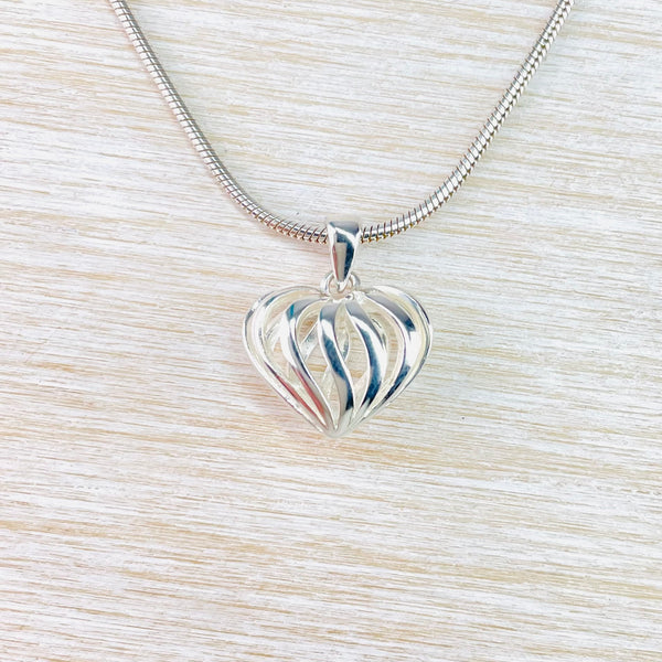 Small Sterling Silver Decorated Heart Shaped Pendant.