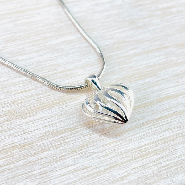 Small Sterling Silver Decorated Heart Shaped Pendant.