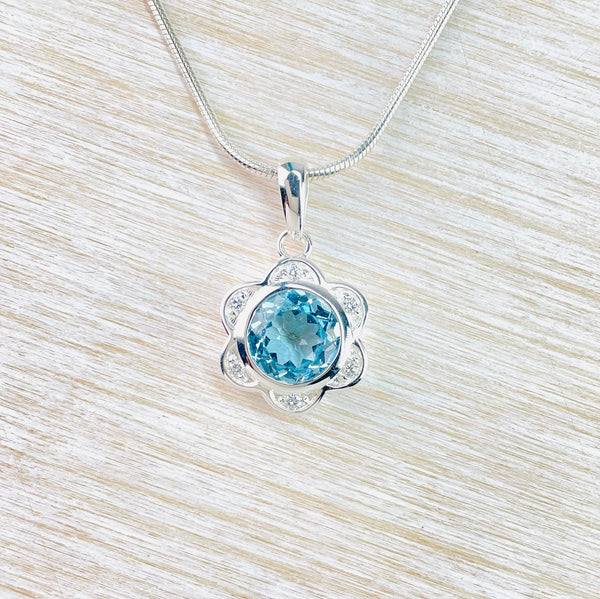 Blue Topaz and Silver Flower Pendant.