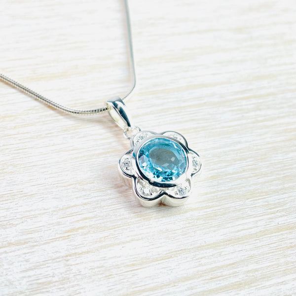 Blue Topaz and Silver Flower Pendant.