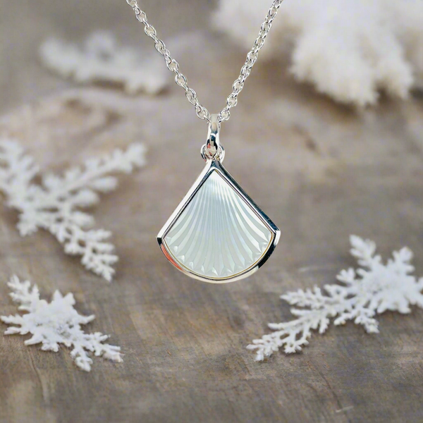 Sterling Silver and Carved Mother of Pearl Pendant.